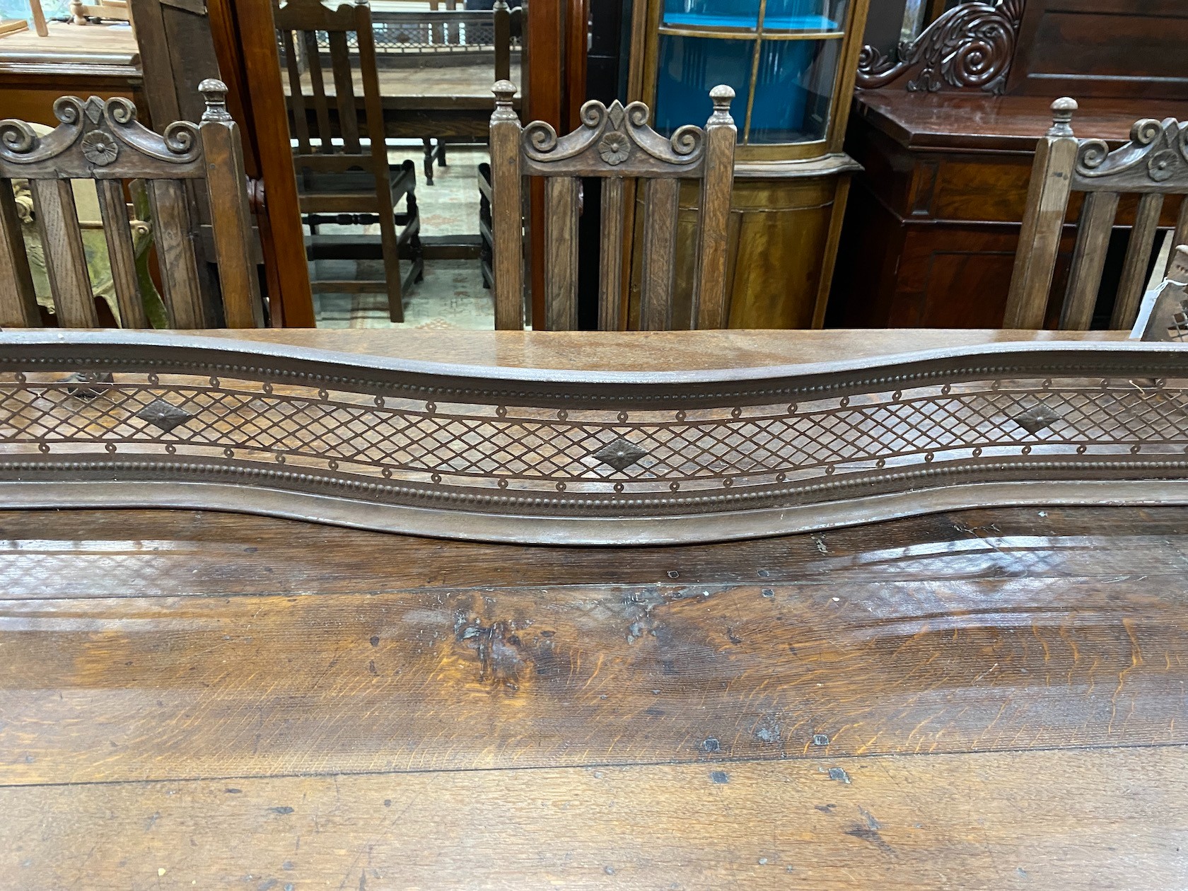 A George III serpentine steel fire curb, width 158cm